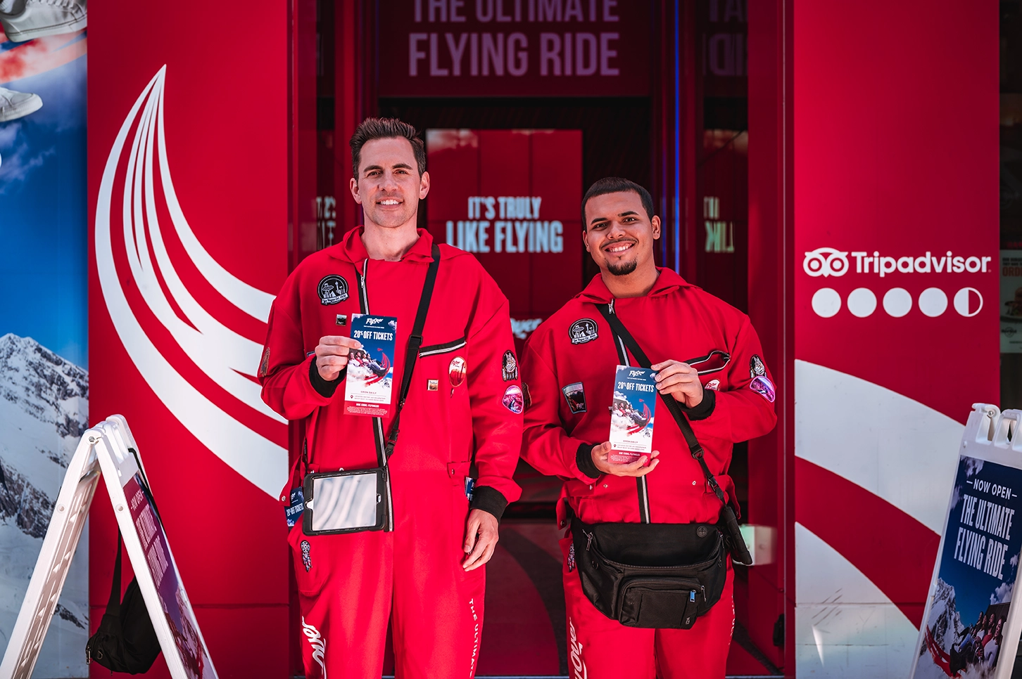 Flyover Vegas Experiential Marketing Kre8 Media Two men promote flying ride with tickets.